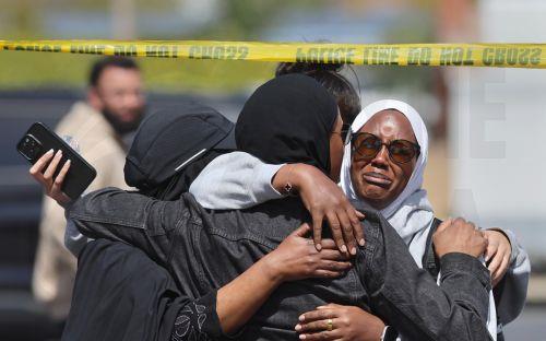 epa12972650 Members of the muslim community in San Diego react after learning news about a shooting incident at their house of worship in San Diego, California, USA, 18 May 2026. Police agencies from across San Diego County responded to an active shooter incident at the Islamic Center of San Diego in the Clairemont neighborhood. Three people were killed,...