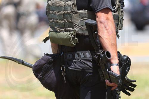 epa12972651 A law enforcement personnel stands on the scene to respond to an active shooting incident at the Islamic Center of San Diego, located in the Clairemont neighborhood in San Diego, California, USA, 18 May 2026.  Police agencies from across San Diego County responded to an active shooter incident at the Islamic Center of San Diego in the Clairemont...