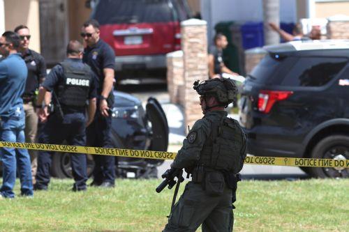 epa12972655 Law enforcement personnel gather on the scene to respond to an active shooting incident at the Islamic Center of San Diego, located in the Clairemont neighborhood in San Diego, California, USA, 18 May 2026.  Police agencies from across San Diego County responded to an active shooter incident at the Islamic Center of San Diego in the Clairemont...