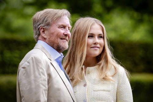 epa12981004 Dutch King Willem-Alexander (L) and Princess Amalia (R) pose during the traditional royal family photo session in the Dutch Garden in Clingendael Park in The Hague, The Netherlands, 21 May 2026.  EPA/ROBIN VAN LONKHUIJSEN