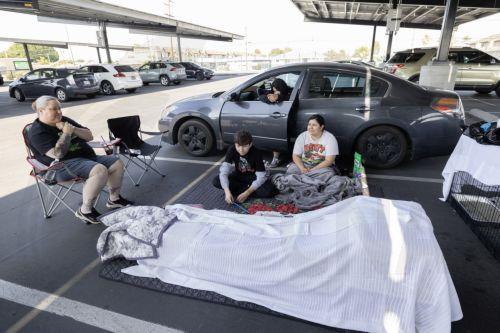 epa12989304 Family members from Anaheim, Andrea Luna, Jules Olivas, Joshua Olivas, and Jessica Castro and their 8 cats are sheltering in their cars at JFK High School evacuation center after evacuating their home due to a chemical leak from a large storage tank at the GKN Aerospace facility; in Garden Grove, California USA, 23 May 2026. A failing...
