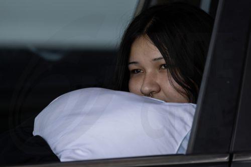 epa12989309 Jules Olivas rests in her car at JFK High School evacuation center after evacuating her home due to a chemical leak from a large storage tank at the GKN Aerospace facility; in Garden Grove, California USA, 23 May 2026. A failing 34,000-gallon tank of methyl methacrylate overheated, prompting tens of thousands of evacuations in the Garden Grove...