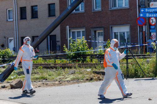 epaselect epa12994680 Members of emergency services operate at the scene of a collision between a train and a school minibus at a railroad crossing in Buggenhout, Belgium, 26 May 2026. According to statements from Belgian Mobility Minister Jean-Luc Crucke and local authorities, four people, including two children, were confirmed dead and several others...