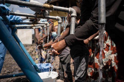 epa12997439 Locals wash their hands at a checkpoint set up for preventive measures against the spread of Ebola in Kanyaruchinya, near Goma, North Kivu, Democratic Republic of Congo, 27 May 2026. The World Health Organization (WHO) has declared the Ebola outbreak, caused by the Bundibugyo virus, in the Democratic Republic of the Congo a public health...