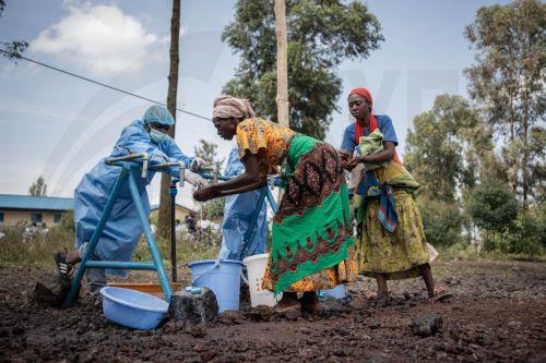 epa12997440 Locals wash their hands at a checkpoint set up for preventive measures against the spread of Ebola in Kanyaruchinya, near Goma, North Kivu, Democratic Republic of Congo, 27 May 2026. The World Health Organization (WHO) has declared the Ebola outbreak, caused by the Bundibugyo virus, in the Democratic Republic of the Congo a public health...
