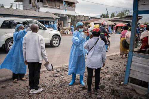 epa12997442 Health workers in protective gowns and masks check locals’ temperature as a preventive measure against Ebola in Kanyaruchinya, near Goma, North Kivu, Democratic Republic of Congo, 27 May 2026. The World Health Organization (WHO) has declared the Ebola outbreak, caused by the Bundibugyo virus, in the Democratic Republic of the Congo a public...