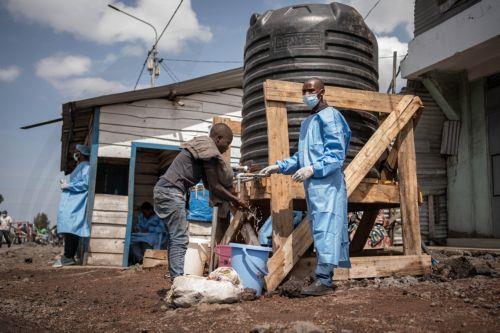 epa12997444 Locals wash their hands at a checkpoint set up for preventive measures against the spread of Ebola in Kanyaruchinya, near Goma, North Kivu, Democratic Republic of Congo, 27 May 2026. The World Health Organization (WHO) has declared the Ebola outbreak, caused by the Bundibugyo virus, in the Democratic Republic of the Congo a public health...