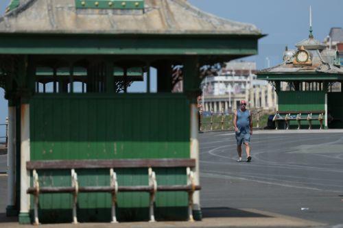 epa12997964 A person walks along the promenade in Blackpool, Britain, 27 May 2026. The UK is experiencing a record-breaking heatwave, with temperatures exceeding 35 degrees Celsius, making May the hottest on record.  EPA/ADAM VAUGHAN