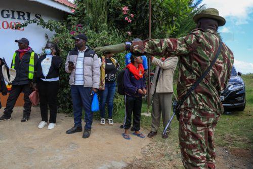 epa12999944 Students and parents gather at Utumishi Girls Academy following a deadly fire in Nakuru, 120 kilometers northwest of Nairobi, Kenya, 28 May 2026. At least 16 students were killed in a fire in the school dormitory overnight, according to police and government officials.  EPA/STRINGER