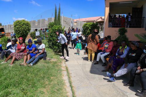epa12999945 Students and parents gather at Utumishi Girls Academy following a deadly fire in Nakuru, 120 kilometers northwest of Nairobi, Kenya, 28 May 2026. At least 16 students were killed in a fire in the school dormitory overnight, according to police and government officials.  EPA/STRINGER