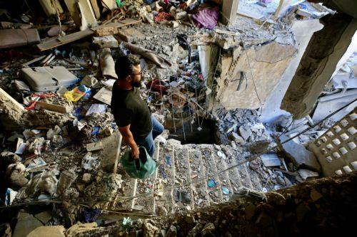 epa12999967 A man inspects the damage inside a building following an Israeli airstrike in the southern coastal city of Sidon, Lebanon, 28 May 2026. At least four people were killed and several others injured in the attack. On 27 May, Israel had designated all regions south of the Zahrani River in Lebanon, roughly 40km from the border, including Tyre, as...