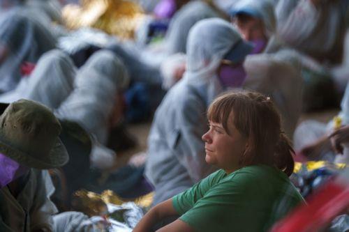 epa13003746 Swedish climate activist Greta Thunberg (C) rests in a shaded area at a Uniper power plant in Gelsenkirchen, Germany, 29 May 2026. Members of the organization 'Ende Gelaende' entered the plant's grounds during a protest action, leading to a blockade of the facility.  EPA/CHRISTOPH RUTENKOLK
