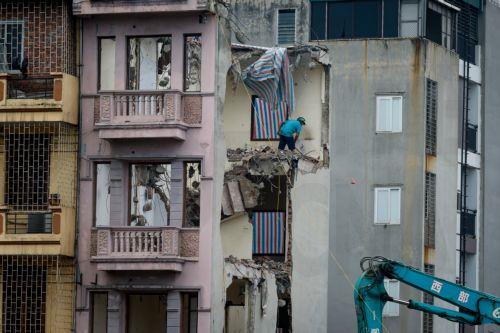 epa13017065 A man works at a demolition site in Hanoi, Vietnam, 05 June 2026. World Environment Day is celebrated globally every year on 05 June and aims to bring awareness to environmental issues. The theme for 2026 is ‘Inspired by Nature. For Climate. For Our Future’.  EPA/LUONG THAI LINH