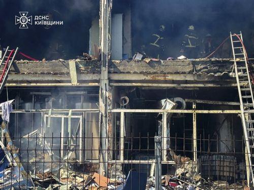 epa13017291 A handout photo made available by the State Emergency Service shows Ukrainian rescuers working at the site of a Russian strike on a food industry enterprise in Kyiv's area, Ukraine, 05 June 2026, amid the ongoing Russian invasion. At least four people were killed and four others were injured in an overnight Russian attack on the food industry...