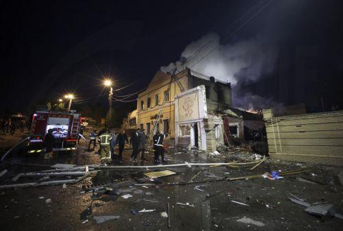 epa13025592 Ukrainian rescuers work at the site of a Russian strike on a residential area in Kharkiv, Ukraine, 09 June 2026, amid the ongoing Russian invasion. At least three people were killed and 18 injured, including two children, as Russia attacked Kharkiv and the region, according to the State Emergency Service.  EPA/SERGEY KOZLOV