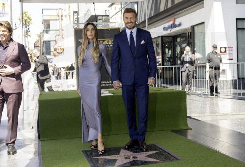 epa13033496 British former soccer player David Beckham (R) poses with his wife, British singer Victoria Beckham (L), during a ceremony honoring Beckham with a star on the Hollywood Walk of Fame in Los Angeles, California, USA, 12 June 2026. Beckham was recognized in the Sports Entertainment category.  EPA/TED SOQUI