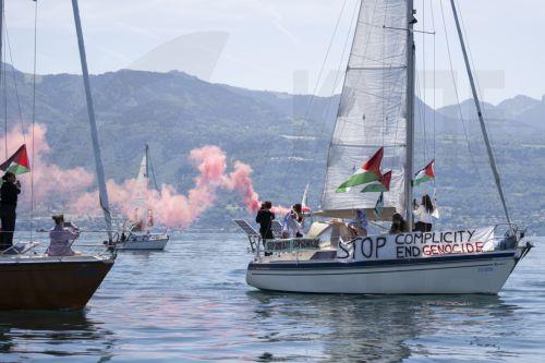 epa13034262 Boats from the Gaza Freedom Flotilla participate in the rally 'The G7 Can stop the Genocide' on Lake Geneva ahead of the upcoming G7 summit, off the coast of Lausanne, Switzerland, 13 June 2026. The summit will be held in Evian-les-Bains, France, near the Swiss border, from 15 to 17 June 2026.  EPA/JEAN-CHRISTOPHE BOTT