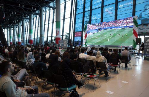 epa13040320 Iranians react as they watch a broadcast of the FIFA World Cup 2026 Group G soccer match between Iran and New Zealand in Tehran, Iran, 16 June 2026.  EPA/ABEDIN TAHERKENAREH RESTRICTIONS: NO Access Israel Media/Persian Language TV Stations Outside Iran/Strictly No Access BBC Persian/VOA Persian/Manoto TV/Iran International TV. (As mandated by...