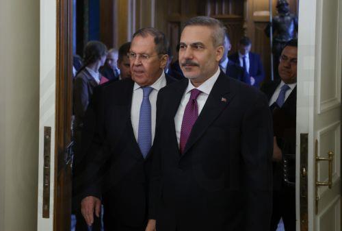 epa13040807 Russian Foreign Minister Sergey Lavrov (L) and Turkish Foreign Minister Hakan Fidan enter a hall during their meeting in Moscow, Russia, 16 June 2026.  EPA/SERGEI ILNITSKY