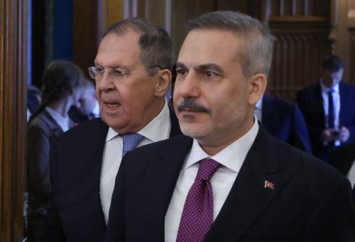 epa13040810 Russian Foreign Minister Sergey Lavrov (L) and Turkish Foreign Minister Hakan Fidan enter a hall during their meeting in Moscow, Russia, 16 June 2026.  EPA/SERGEI ILNITSKY