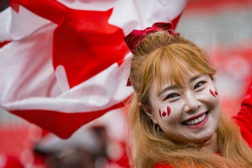 epaselect epa13048385 A fan cheers for Canada prior to the start of the FIFA World Cup 2026 group stage match between Canada and Qatar in Vancouver, Canada, 18 June 2026.  EPA/BOB FRID