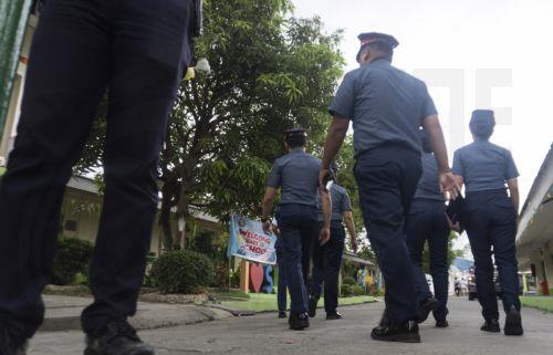 epa13056474 Philippine police officers enter the San Jose National High School in Tacloban City, Leyte province, Philippines, 22 June 2026. According to the Tacloban City Police Office (TCPO), three students were killed and more than five others were injured and taken to medical facilities for treatment. TCPO said the two suspects have been taken into...
