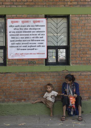 epa13060614 People stand outside the closed Central Zoo after it was shut indefinitely following a bird flu outbreak among its birds in Lalitpur, Nepal, 24 June 2026. Multiple poultry farms across all three districts of the Kathmandu Valley have been affected by the avian influenza A (H5N1) virus. Nepal's only central zoo was closed indefinitely after birds...
