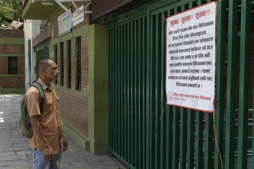 epa13060613 People stand outside the closed Central Zoo after it was shut indefinitely following a bird flu outbreak among its birds in Lalitpur, Nepal, 24 June 2026. Multiple poultry farms across all three districts of the Kathmandu Valley have been affected by the avian influenza A (H5N1) virus. Nepal's only central zoo was closed indefinitely after birds...
