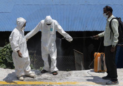 epaselect epa13060573 Members of a rapid response team from the Department of Livestock Services being disinfect after culling chickens at a poultry farm in Bhaktapur, Nepal, 24 June 2026. Multiple poultry farms across all three districts of the Kathmandu Valley have been affected by the avian influenza A (H5N1) virus. Nepal's only central zoo was closed...