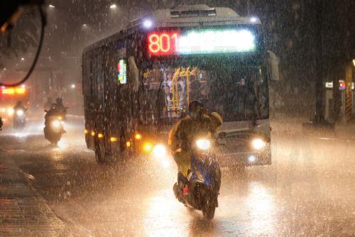 epa13063454 A motorists maneuvers during a downpour of rain in Taipei, Taiwan, 25 June 2026. The local authorities in Hualien County ordered evacuations in parts of Wanrong and Fenglin following a yellow alert that a nearly full upstream barrier lake might overflow within 48 hours. Rainfall tied to Severe Tropical Storm Mekkhala was expected, prompting...