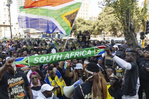 epa13066099 Members of the Tsonga tribe gather as they protest against the nation wide anti-immigrant movement that is planning a national shutdown on 30 June in Johannesburg, South Africa, 26 June 2026.  The march was organized in response to the killing of Nhlamulo Sambo in Mossel Bay (Western Cape), where he was reportedly targeted during anti-migrant...