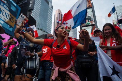 epa13067831 Panama soccer fans celebrate in Times Square one day before their team plays against England, in New York, New York USA, 26 June 2026.  EPA/OLGA FEDOROVA