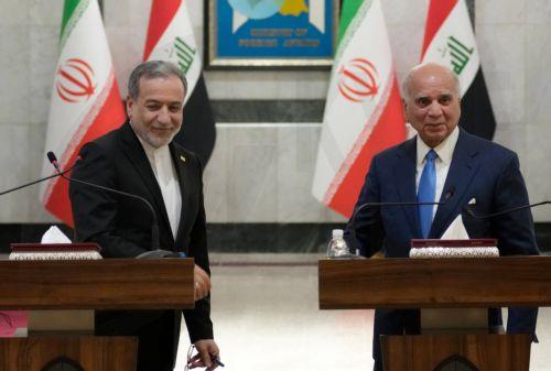 epa13070551 Iranian Foreign Minister Abbas Araghchi (L) and Iraqi Foreign Minister Fuad Hussein hold a joint press conference following their meeting at the Ministry of Foreign Affairs in Baghdad, Iraq, 28 June 2026.  EPA/CEERWAN AZEEZ