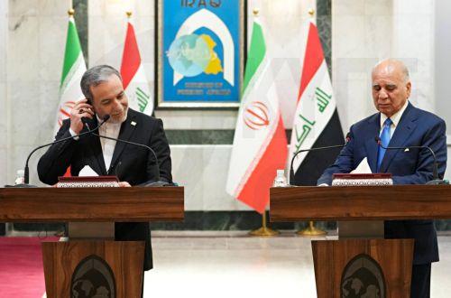 epa13070553 Iranian Foreign Minister Abbas Araghchi (L) and Iraqi Foreign Minister Fuad Hussein hold a joint press conference following their meeting at the Ministry of Foreign Affairs in Baghdad, Iraq, 28 June 2026.  EPA/CEERWAN AZEEZ