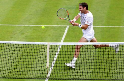 epa13072331 Cameron Norrie of Great Britain hits a backhand in his Men's Singles first round match against Michael Zheng of the USA at the Wimbledon Championships in London, Britain, 29 June 2026.  EPA/NEIL HALL