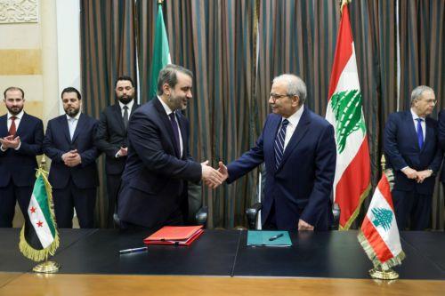 epa13079827 Lebanese Prime Minister Nawaf Salam (R) and Syrian Foreign Minister Asaad Al Shaibani (L) shake hands following the signing of a document on the formation of a joint Syrian‑Lebanese committee following their meeting at the Government Palace in Beirut, Lebanon, 02 July 2026. Shaibani is on an official visit to Beirut to meet Lebanon's leaders. ...