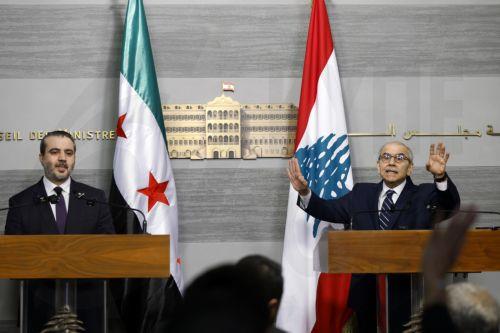 epa13079831 Lebanese Prime Minister Nawaf Salam (R) speaks during a joint press conference with Syrian Minister of Foreign Affairs Asaad Al Shaibani (L) following their meeting at the Government Palace in Beirut, Lebanon, 02 July 2026. Shaibani is on an official visit to Beirut to meet Lebanon's leaders.  EPA/WAEL HAMZEH