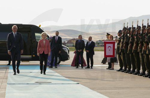 epa13092328 European Commission President Ursula von der Leyen (R) is welcomed by Turkish Minister of Culture and Tourism, Mehmet Nuri Ersoy (L), at Esenboga Airport ahead of the 36th NATO Heads of State and Government Summit in Ankara, Turkiye, 06 July 2026. The summit will take place on 07–08 July, focusing on strengthening defense industrial production...