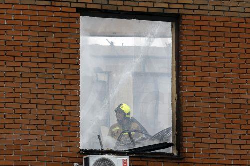 epa13098288 A Ukrainian rescuer works at the site of a Russian drone strike on a building in Kyiv, Ukraine, 08 July 2026, amid the Russian invasion. The State Emergency Service of Ukraine reported that at least two people were killed, and several injured, as a result of the Russian attack on a storage facility.  EPA/SERGEY DOLZHENKO