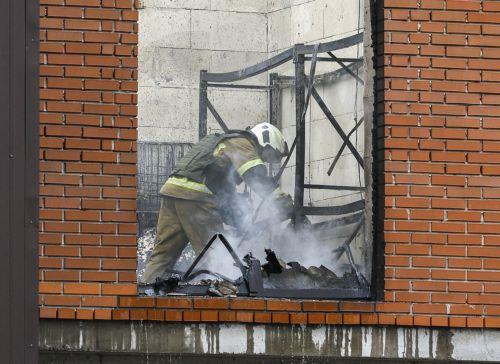 epa13098289 A Ukrainian rescuer works at the site of a Russian drone strike on a building in Kyiv, Ukraine, 08 July 2026, amid the Russian invasion. The State Emergency Service of Ukraine reported that at least two people were killed, and several injured, as a result of the Russian attack on a storage facility.  EPA/SERGEY DOLZHENKO