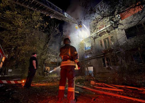 epa13108002 Ukrainian rescuers work at the site of a Russian strike on a residential building in Zaporizhzhia, Ukraine, late 12 July 2026 (issued 13 July 2026), amid the ongoing Russian invasion. According to Zaporizhzhia Oblast Governor Ivan Fedorov, at least 13 people, including a child, were injured following overnight strikes by the Russian military...