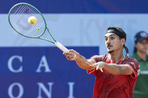 epa13108104 Lorenzo Sonego of Italy in action against Joel Schwaerzler of Austria during their men’s single match at the Swiss Open tennis tournament in Gstaad, Switzerland, 13 July 2026.  EPA/PETER SCHNEIDER