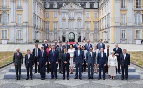 epa13116896 German Chancellor Friedrich Merz (C-R) and French President Emmanuel Macron (C-L) pose with ministers from both countries for a group picture during the 26th Franco-German Ministerial Council at Augustusburg Palace in Bruehl, Germany, 17 July 2026. France and Germany are expected to announce the first ever participation of German soldiers in...