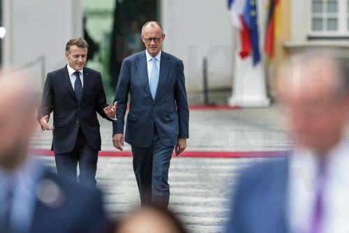 epa13116916 German Chancellor Friedrich Merz (R) and French President Emmanuel Macron (L) arrive for a group picture with ministers from both countries during the 26th Franco-German Ministerial Council at Augustusburg Palace in Bruehl, Germany, 17 July 2026. France and Germany are expected to announce the first ever participation of German soldiers in...