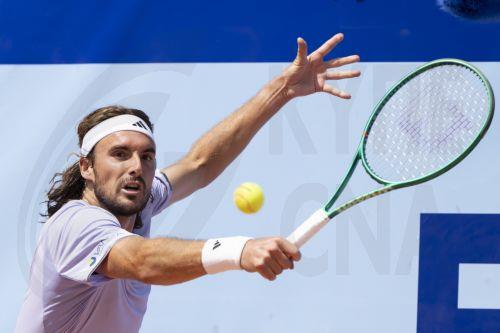 epa13120222 Stefanos Tsitsipas of Greece in action during the men's singles final against Raphael Collignon of Belgium at the Swiss Open tennis tournament in Gstaad, Switzerland, 19 July 2026.  EPA/ANTHONY ANEX