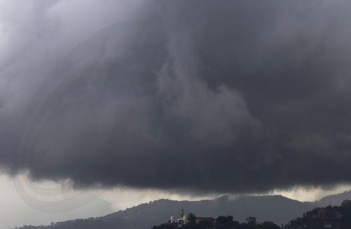 epa13124217 Monsoon clouds gather over the Swayambhu Stupa, a landmark in Kathmandu, before monsoon rainfall in Kathmandu, Nepal, 21 July 2026. Nepal's Meteorological Forecasting Division has announced that the monsoon season has officially begun across the country.  EPA/NARENDRA SHRESTHA