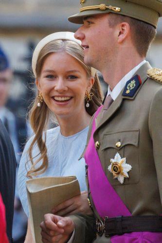 epa13124361 Princess Eleonore (L) and Prince Gabriel greet people outside the St. Michael & St. Gudula Cathedral after the Te Deum mass during Belgium's National Day celebrations in Brussels, Belgium, 21 July 2026.  EPA/OLIVIER MATTHYS