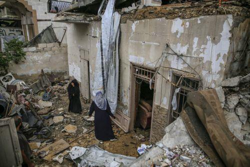 epa13124385 Palestinian women inspect the destroyed house of the Al-Masri family following an Israeli attack, in Gaza City, Gaza Strip, 21 July 2026. Firas Al-Masri, his wife, Salsabil, and their four children were killed in Gaza City, when the Israeli army targeted their home with a drone early 21 July, according to the Gaza Ministry of Health. ...