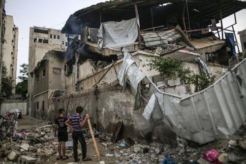 epa13124386 Palestinian youths stand amid the rubble from the destroyed house of the Al-Masri family following an Israeli attack, in Gaza City, Gaza Strip, 21 July 2026. Firas Al-Masri, his wife, Salsabil, and their four children were killed in Gaza City, when the Israeli army targeted their home with a drone early 21 July, according to the Gaza Ministry of...