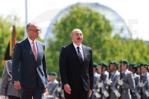 epa13124391 German Chancellor Friedrich Merz (L) welcomes Azerbaijani President Ilham Aliyev with military honors at the Chancellery in Berlin, Germany, 21 July 2026. Merz and Aliyev met for bilateral talks.  EPA/CLEMENS BILAN